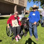 Jen Longdon posts with minature horse and handler, in lawn outside Arizona State House of Representatives.